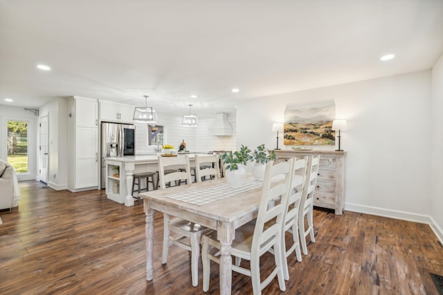 dining area with dark hardwood / wood-style flooring