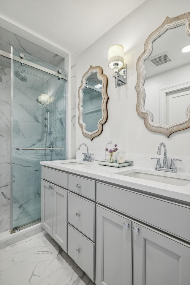 bathroom featuring vanity and a shower with shower door