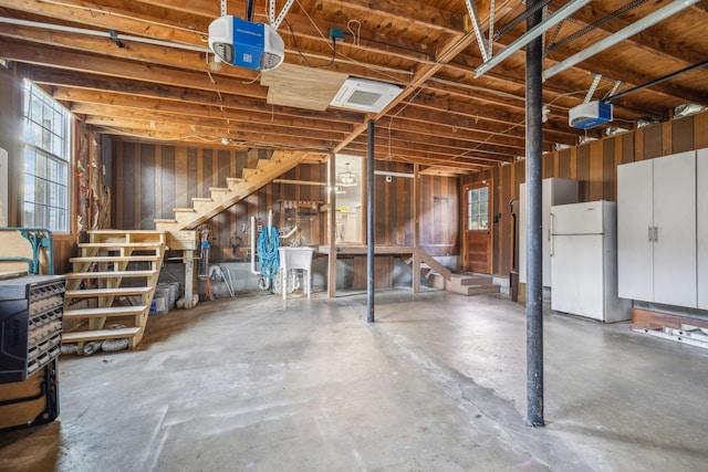 basement with white refrigerator