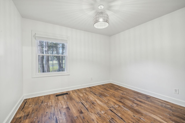 spare room featuring hardwood / wood-style floors