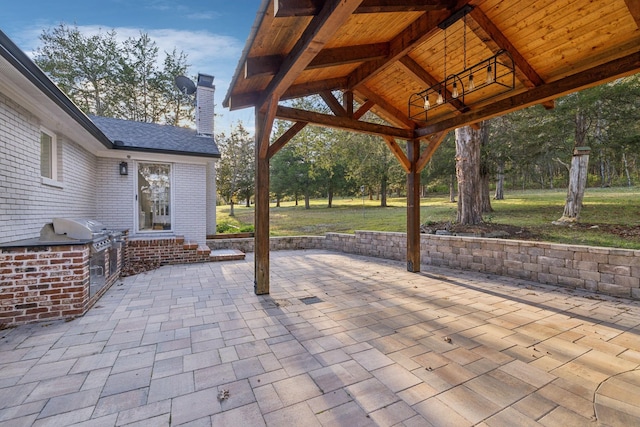 view of patio featuring area for grilling and an outdoor kitchen