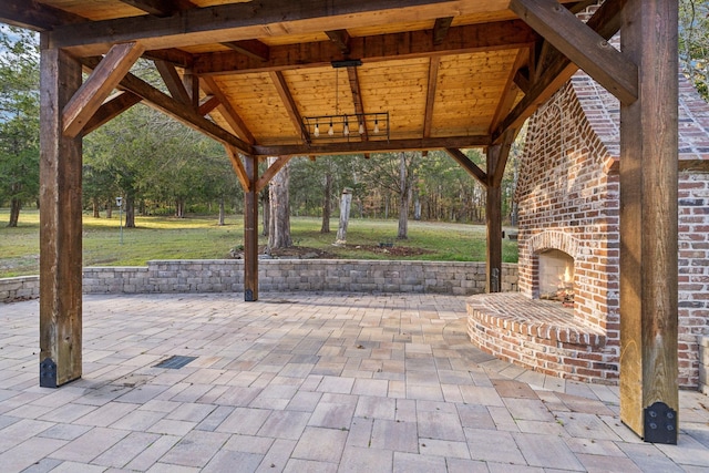 view of patio / terrace with an outdoor brick fireplace