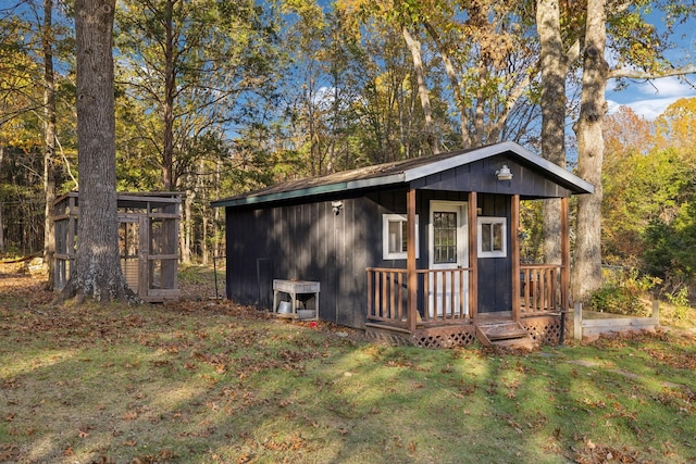 view of outbuilding with a yard