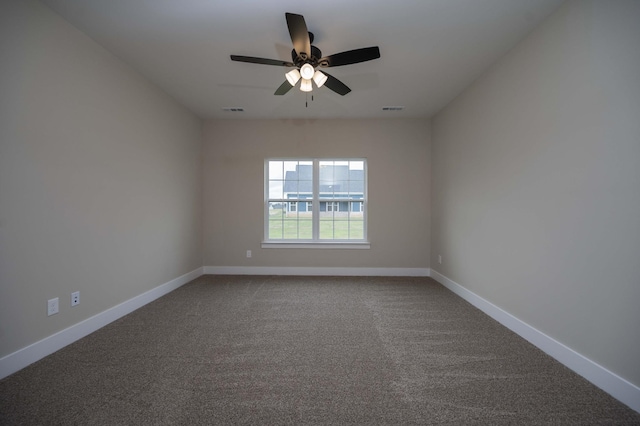 spare room featuring carpet flooring and ceiling fan