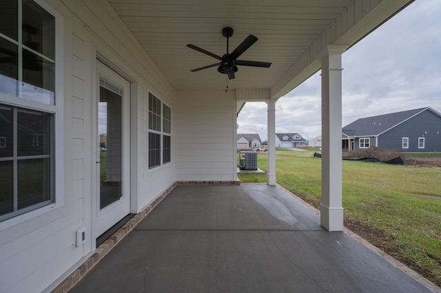 view of patio / terrace with ceiling fan and central AC