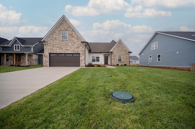 10118 Bighorn Ln, Bell Buckle, TN 37020 - view of front of home with a garage, a front yard, concrete driveway, and brick siding