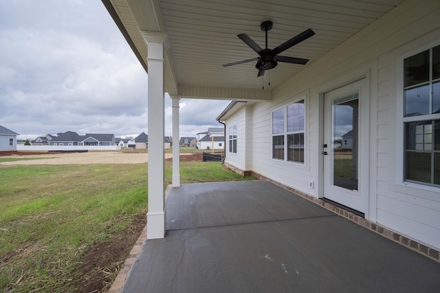 view of patio featuring ceiling fan