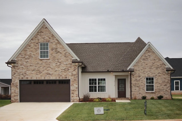 view of front of home featuring a garage and a front yard