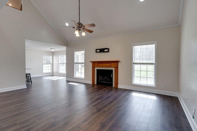 unfurnished living room with ceiling fan, dark wood-type flooring, high vaulted ceiling, crown molding, and a textured ceiling