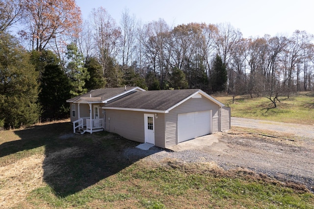 garage featuring a lawn