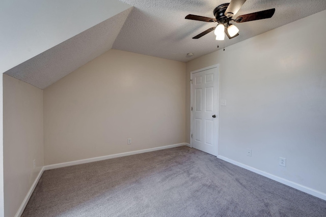 bonus room featuring carpet flooring, ceiling fan, a textured ceiling, and vaulted ceiling