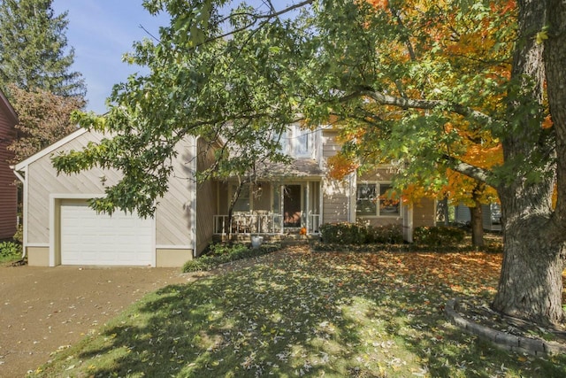 view of front of house featuring a porch and a garage