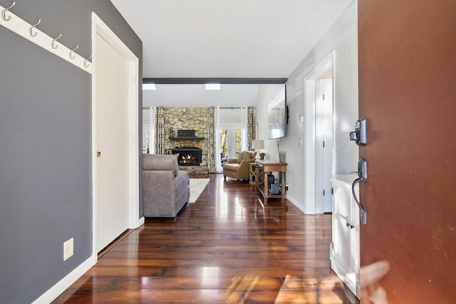 entrance foyer with a fireplace and dark hardwood / wood-style flooring