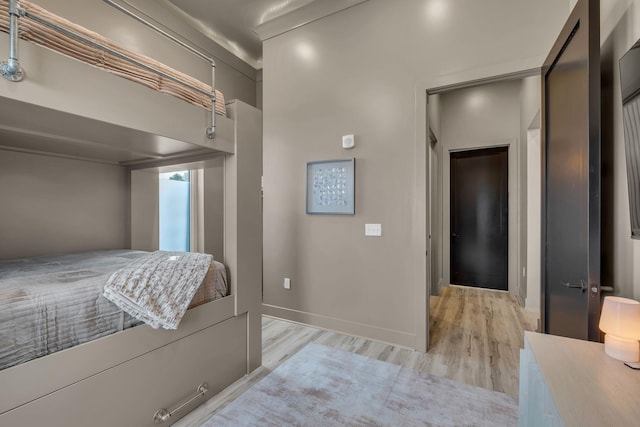 bedroom with light wood-type flooring