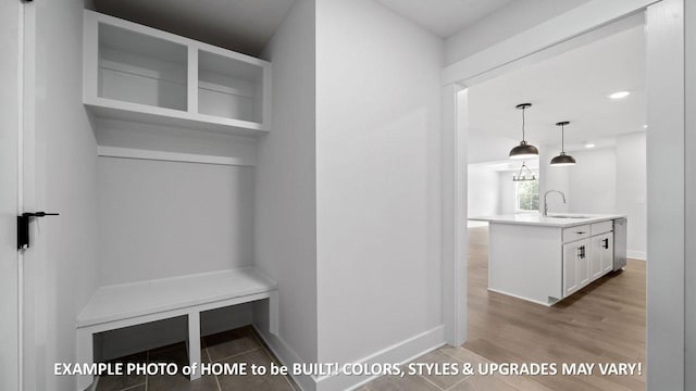 mudroom featuring sink and light hardwood / wood-style floors