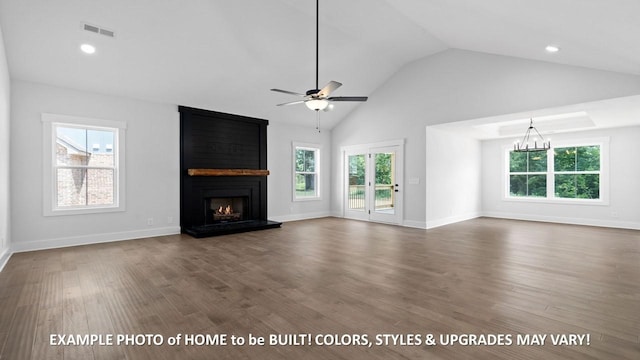 unfurnished living room with high vaulted ceiling, dark hardwood / wood-style floors, ceiling fan with notable chandelier, and a fireplace