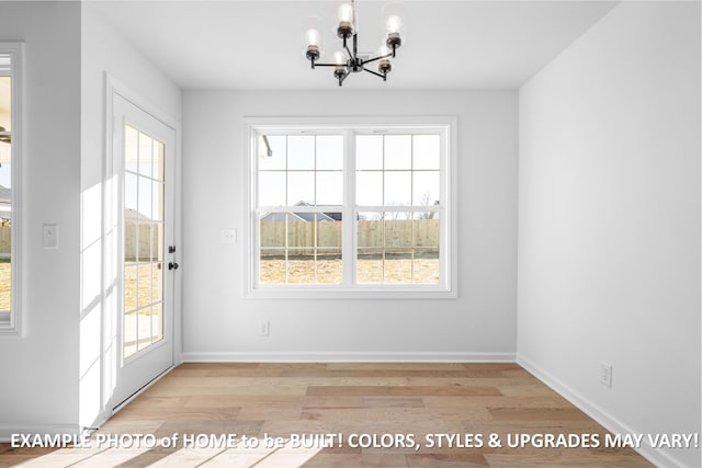 unfurnished dining area featuring a healthy amount of sunlight and light wood-style flooring