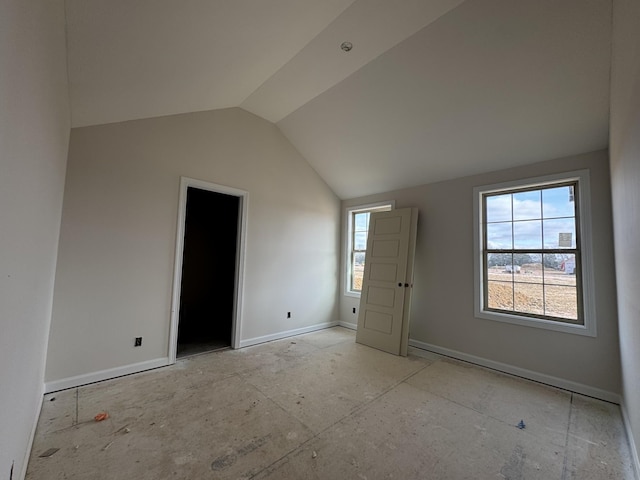 bonus room featuring vaulted ceiling and baseboards