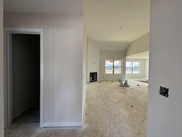 interior space with vaulted ceiling and a fireplace