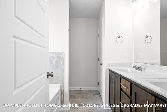 bathroom with a sink, baseboards, and double vanity