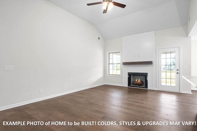 unfurnished living room with a warm lit fireplace, baseboards, vaulted ceiling, and dark wood-style flooring