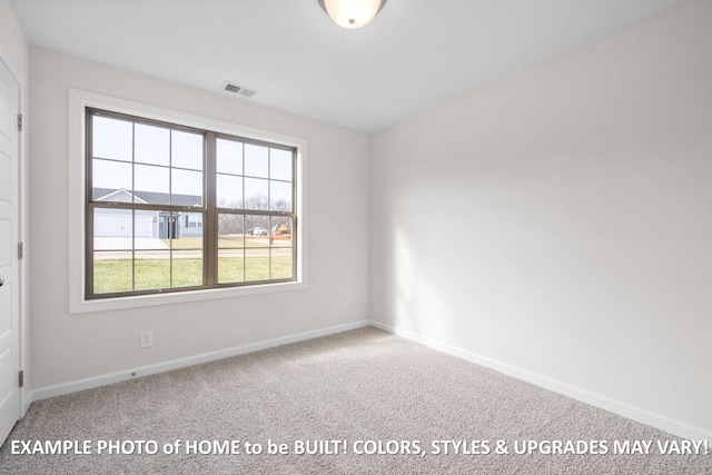 spare room featuring carpet floors, visible vents, and baseboards