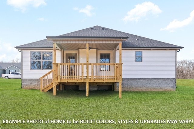 back of property with roof with shingles, a deck, and a yard