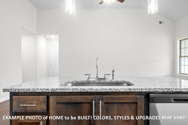 kitchen featuring decorative light fixtures, visible vents, a sink, an island with sink, and dishwasher