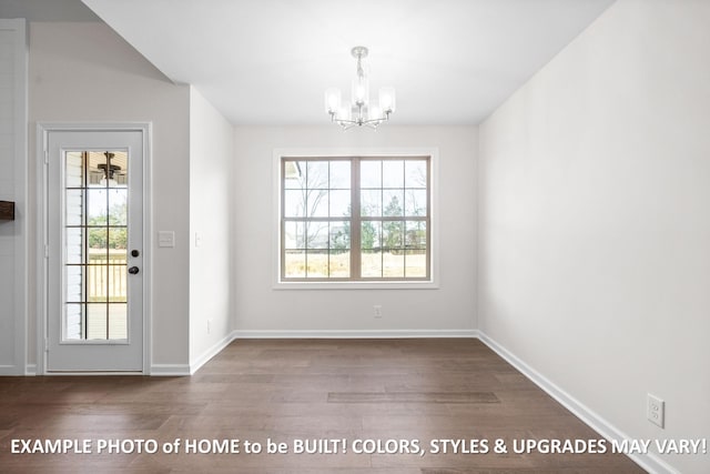 doorway to outside with an inviting chandelier, baseboards, and wood finished floors