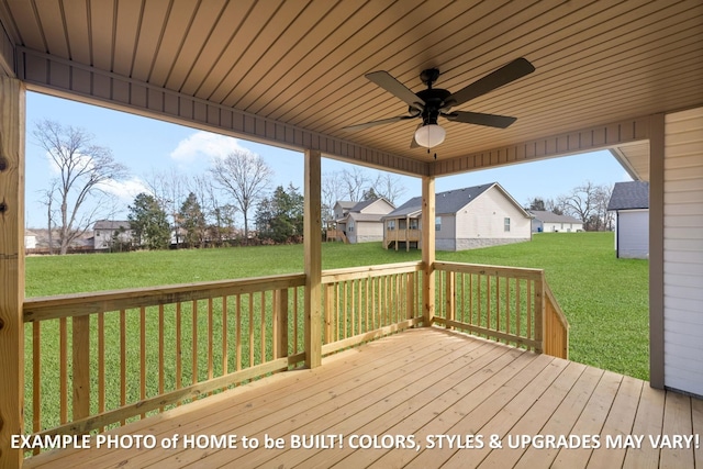 wooden terrace with a lawn, a residential view, and a ceiling fan