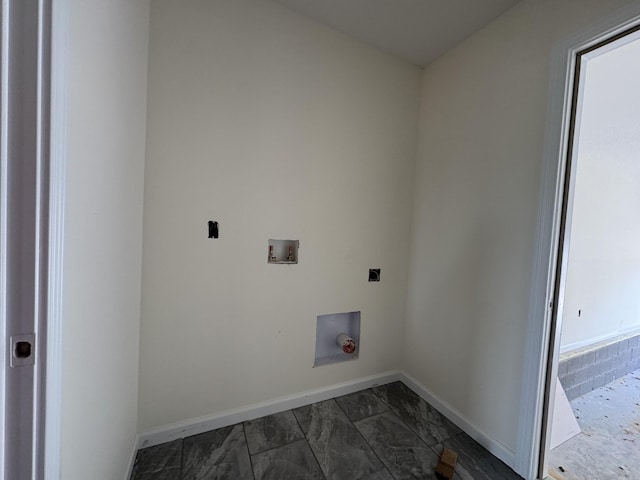 washroom with hookup for a washing machine, laundry area, baseboards, marble finish floor, and electric dryer hookup