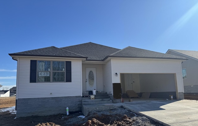 view of front facade featuring a garage, driveway, and roof with shingles