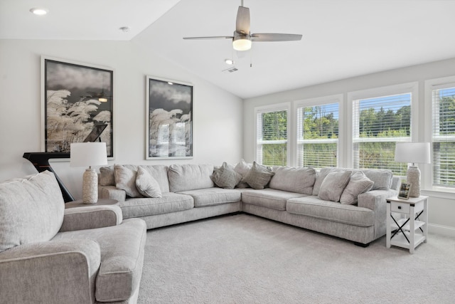 carpeted living room with plenty of natural light, ceiling fan, and lofted ceiling