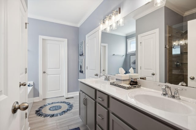 bathroom with a shower with door, vanity, and ornamental molding