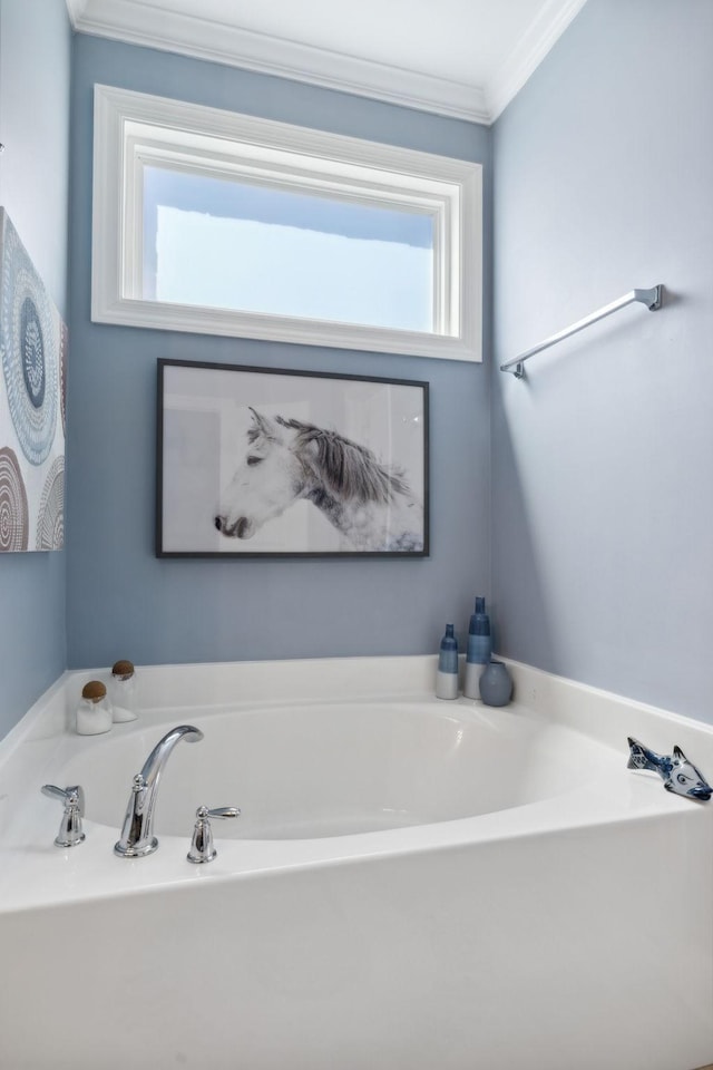 bathroom featuring a tub to relax in and ornamental molding