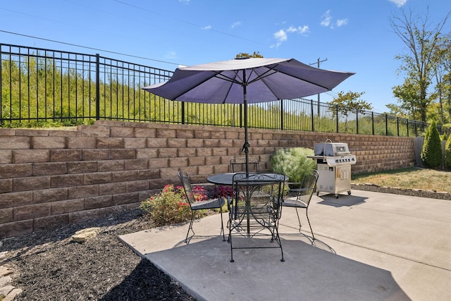 view of patio featuring a grill