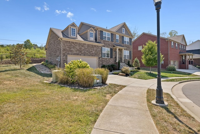 view of front of home with a garage and a front lawn