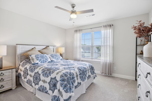 bedroom with light colored carpet and ceiling fan