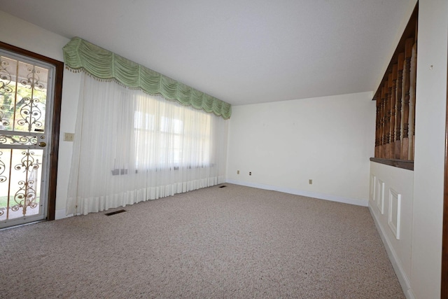 spare room featuring carpet flooring