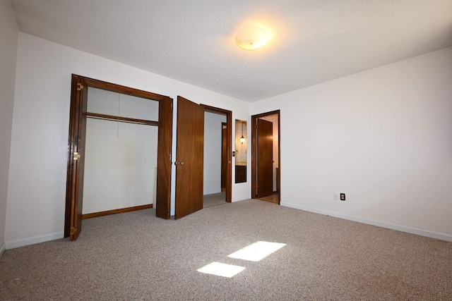 unfurnished bedroom with light carpet