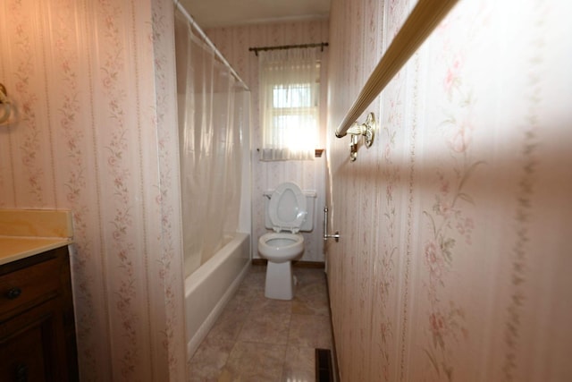 full bathroom featuring tile patterned flooring, vanity, toilet, and shower / tub combo with curtain