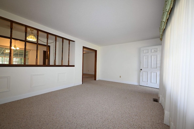 empty room with carpet flooring