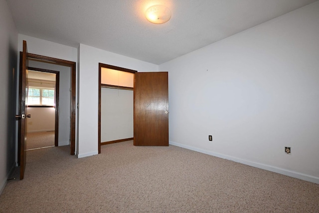 unfurnished bedroom featuring a closet and carpet