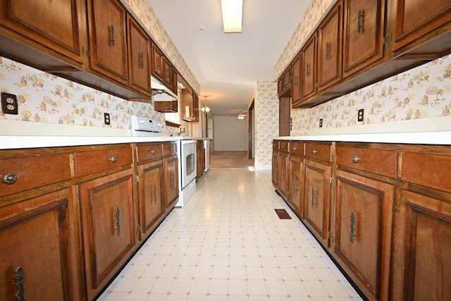 kitchen featuring custom range hood and white stove