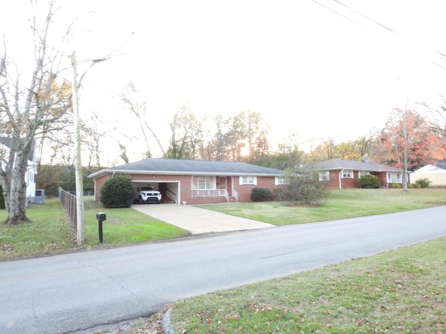 view of front of house with a garage and a front lawn