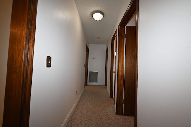 corridor with light colored carpet