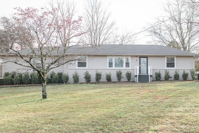 single story home featuring a front lawn