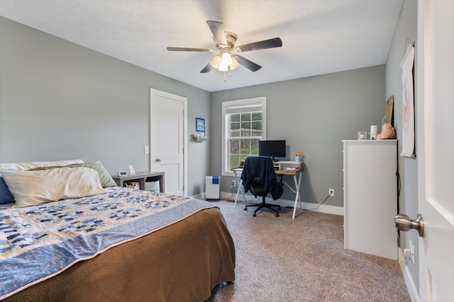 bedroom featuring light carpet, a textured ceiling, and ceiling fan