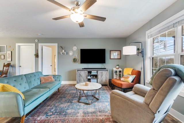 living room with hardwood / wood-style flooring and ceiling fan