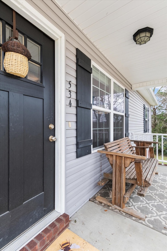 entrance to property with covered porch